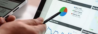 pointing at graphic on tablet